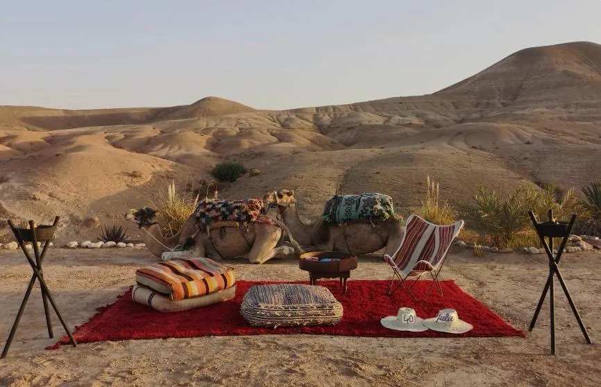 Rugs and lanterns set for a dinner in the Agafay desert